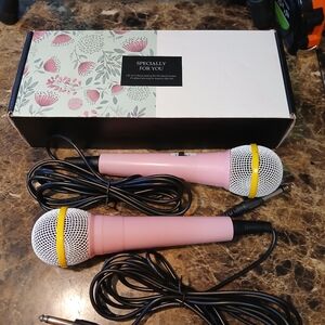 New 2 Pink Microphones with 10ft cord. Great for karaoke The product is a 2 pi